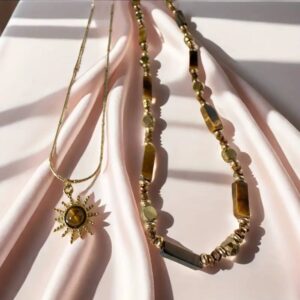 Two necklaces made of natural tiger’s eye stone, gold-plated.