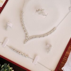 Genuine silver set: necklace, earrings, and bracelet.