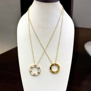 Chain necklace plated with 21-karat gold.